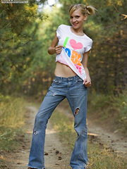 Skinny attractive girl takes off white t-shirt and sexy jeans in heat.