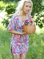 Gorgeous blonde teen chick with a basket of peaches taking off clothes outdoor on the nature.