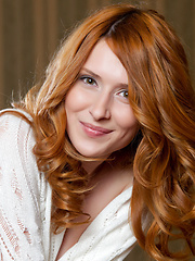 Delightfully slim and slender Dariya gloriously strips her white polo shirt and sprawled on the table, baring her sweet and smooth assets with a charming smile.
