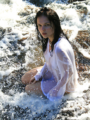 Super model Jenya is photographed dripping wet in the rain.
