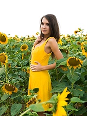Semmi strips her yellow sexy dress and   dazzles us with her voluptuous body   with super smooth and fair skin, puffy large breasts, and her alluring blue eyes in the sunflower field.