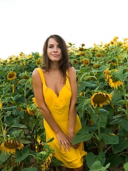 Semmi strips her yellow sexy dress and   dazzles us with her voluptuous body   with super smooth and fair skin, puffy large breasts, and her alluring blue eyes in the sunflower field.
