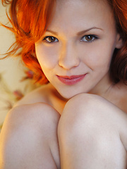 The charming redhead with the vivacious smile, porcelain skin, and absolutely beautiful body, Zarina A enjoys posing nude in front of the camera