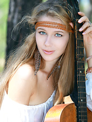 Erica B plays her guitar in the nude