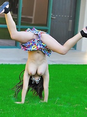 Leila does cartwheels topless outside
