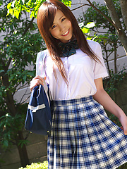 Schoolgirl Iyo Hanak poses at the open air in sexy skirt