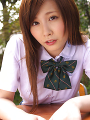 Schoolgirl Iyo Hanak poses at the open air in sexy skirt