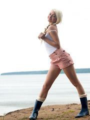 Gorgeous blonde babe gets naughty and naked on a beach