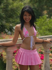 Carol Lopez wears a string bikini and a pink mini skirt and she shakes that latina teen body gives us a hot strip show