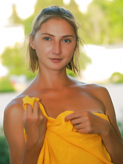 Lovely teen beauty showing perky tits and playful pussy under sexy yellow dress on public.
