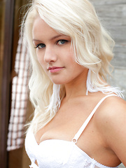 Karina O\'s beautiful blonde hair and stunning blue eyes accentuates her gorgeous body claid in dainty white lingerie.
