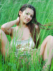 Sofi A teases her amazing breasts out of her little dress in a field of beautiful green grass.
