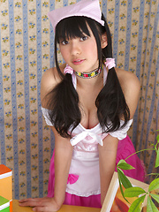 Tomoe Yamanaka Asian in pink maid uniform plays with teddy bear